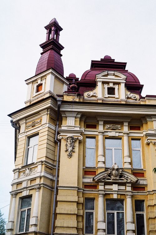 Free A stunning example of Renaissance Revival architecture with ornate details and red rooftops. Stock Photo