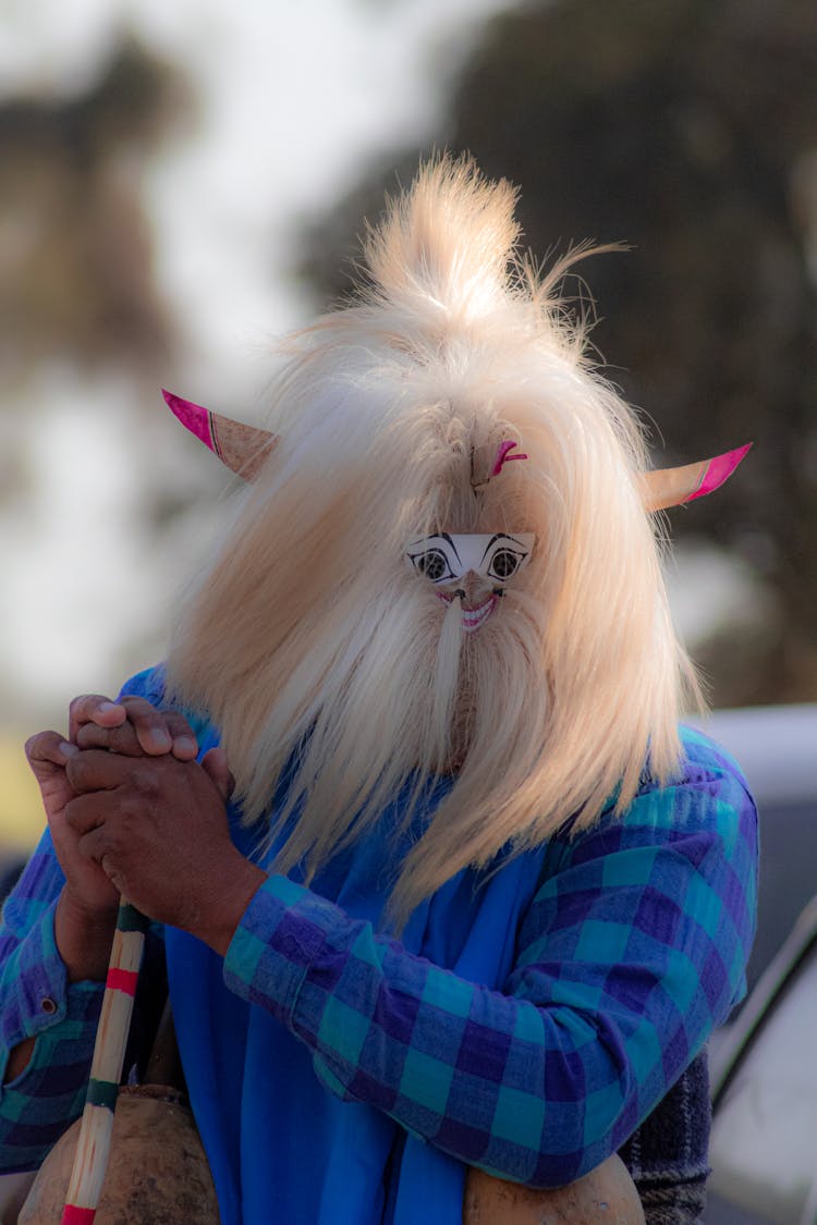 A Man Wearing A Furry Mask