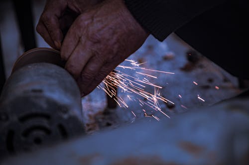 Person Grinding Creating Sparks