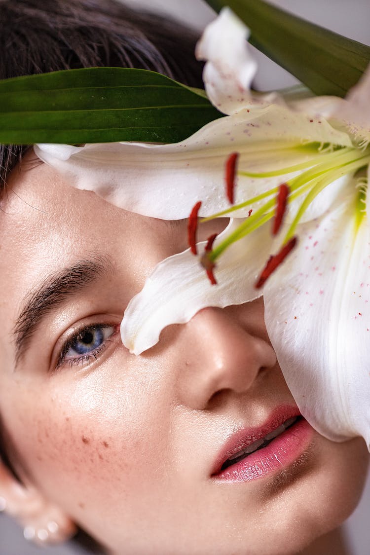 Close-Up Shot A Beautiful Woman With Madonna Lily Flower
