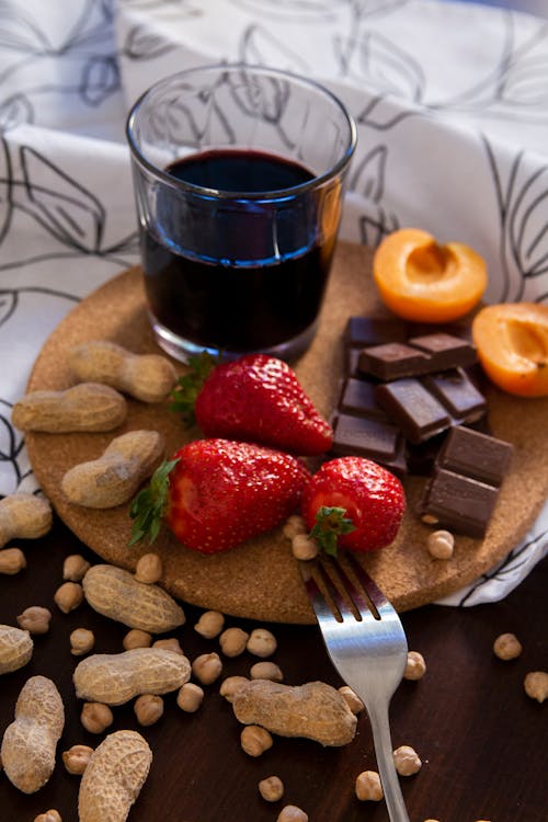 Free Strawberries and Chocolate Bars on Cork Board Stock Photo