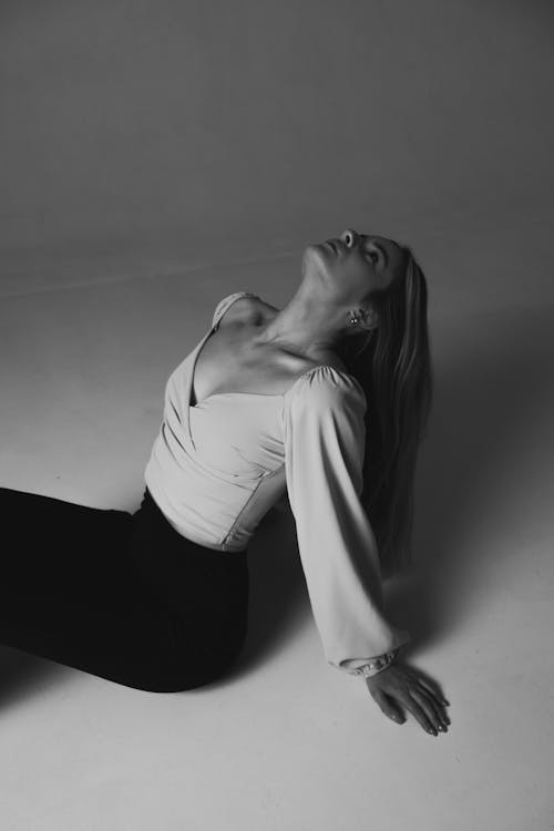 Free Woman in White Long Sleeve Shirt and Black Pants Stock Photo