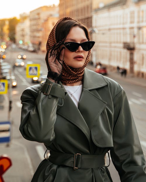 Woman in a Headscarf and Sunglasses Posing in City
