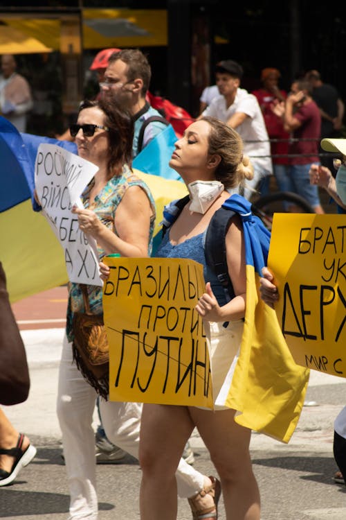 Female Protester holding a Placard 