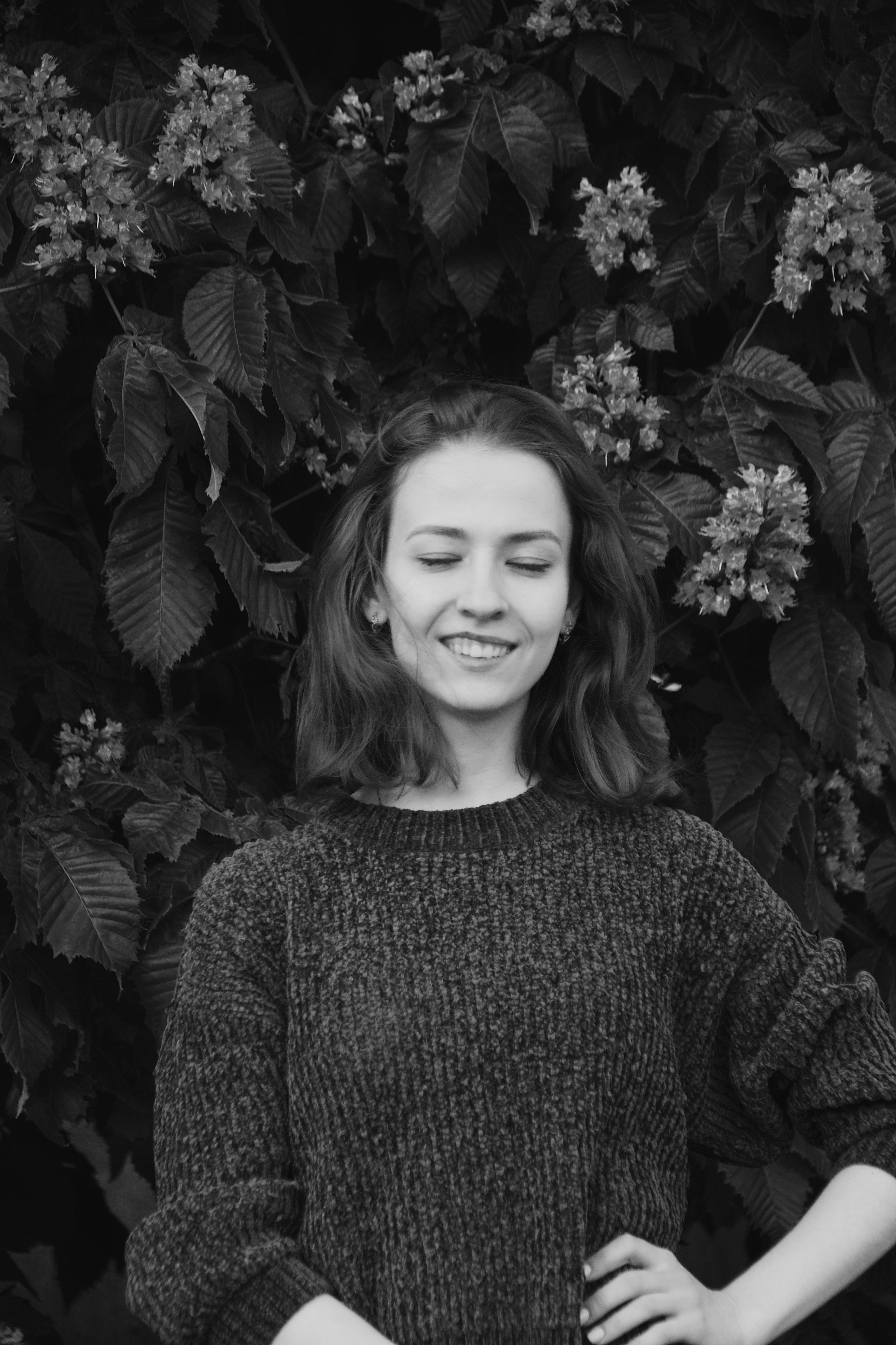 Woman Posing with Hand on Forehead in Black and White · Free Stock Photo