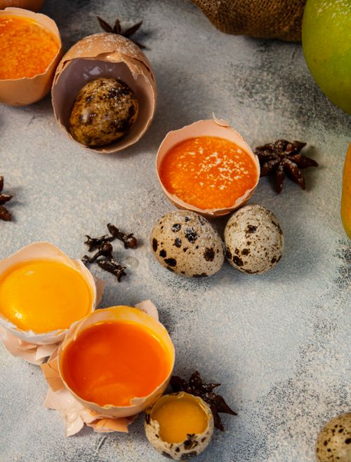 Free Colorful quail eggs and spices in focus, ideal for culinary themes. Stock Photo