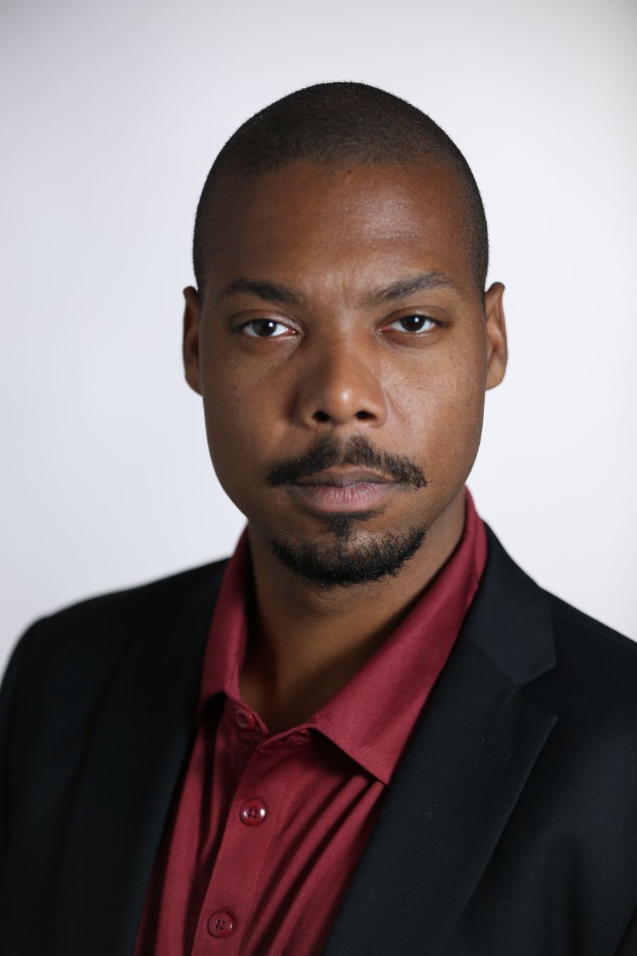 Professional headshot placeholder for David Okeke