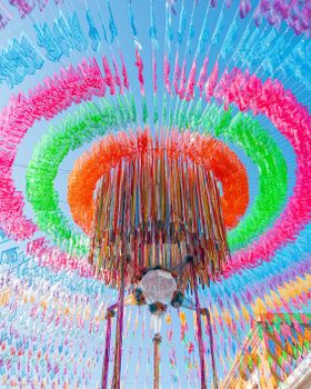 Vivid festival decorations with colorful streamers and lanterns in Oaxaca, Mexico, capturing a festive atmosphere.