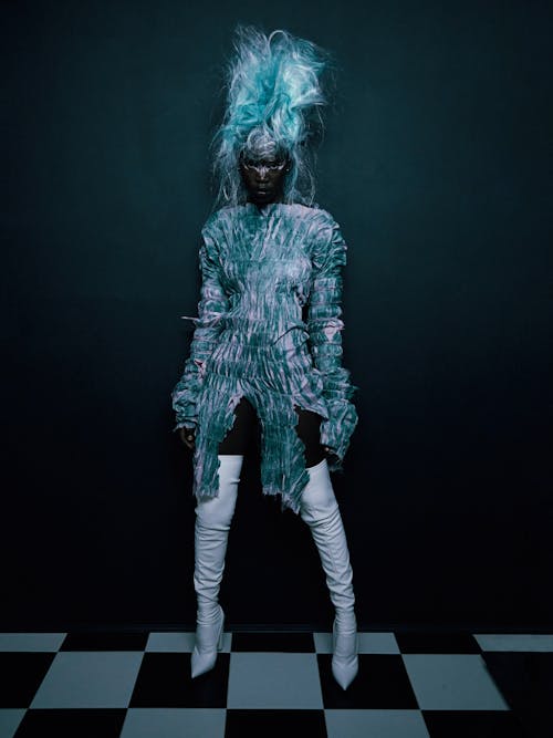 Woman Posing in an Icy Blue Costume, Makeup and Wig 