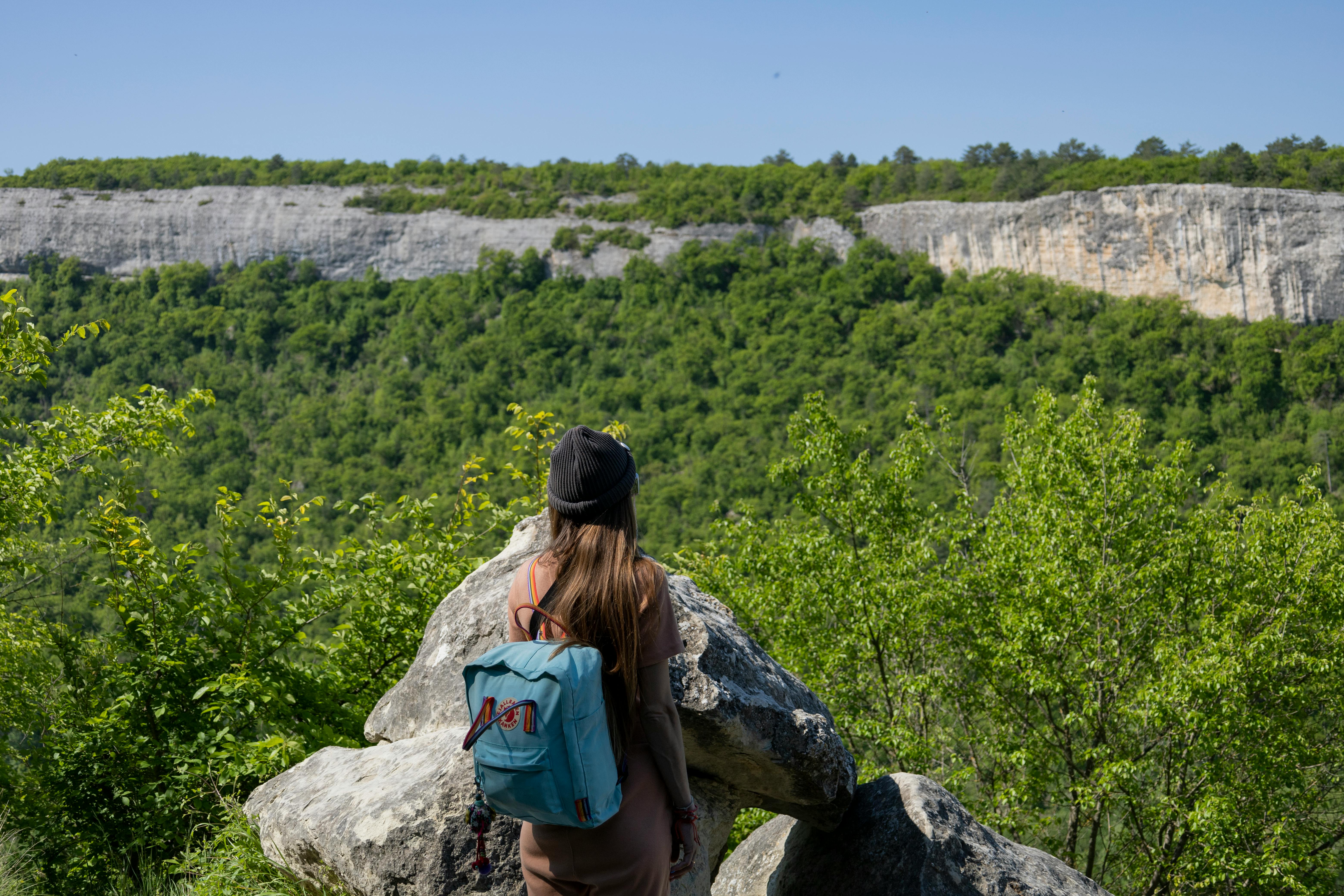 person hiking enjoying view - build up cardio endurance