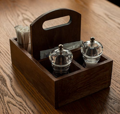 Free Condiment Holder on a Restaurant Table with Salt, Pepper and Sugar  Stock Photo