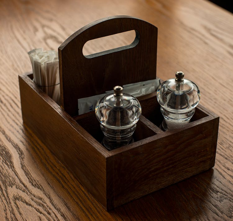 Condiment Holder On A Restaurant Table With Salt, Pepper And Sugar 