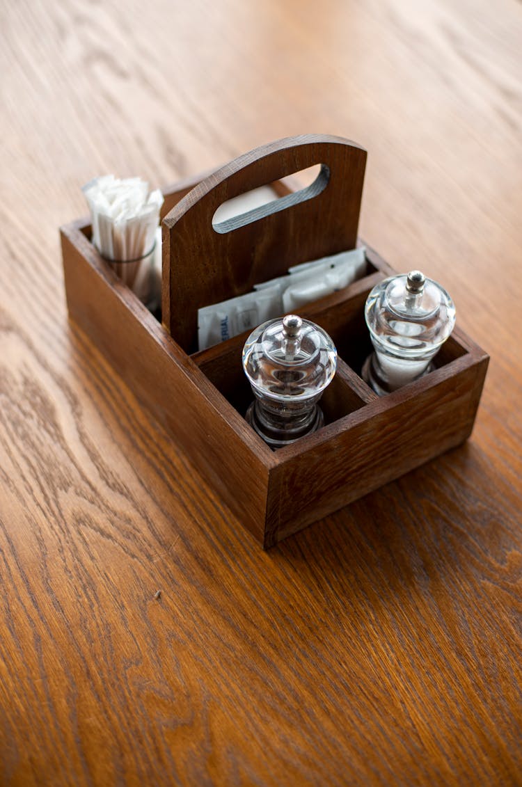 Wooden Condiments Container On The Table