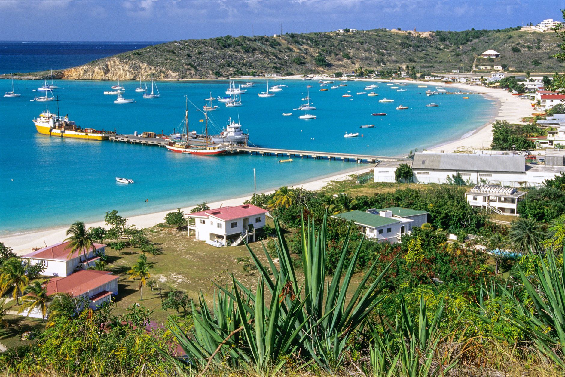 Stunning aerial view of Sandy Ground Bay in Anguilla with boats and turquoise waters.. Photo by Juergen Striewski on Pexels