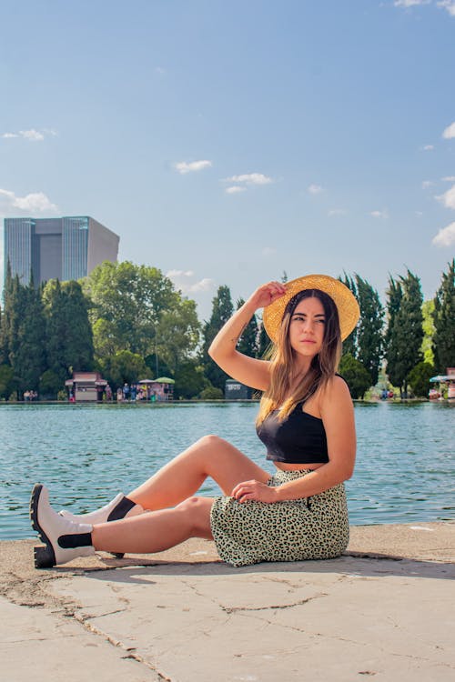 Beautiful Woman in Black Top and Straw Sunhat 