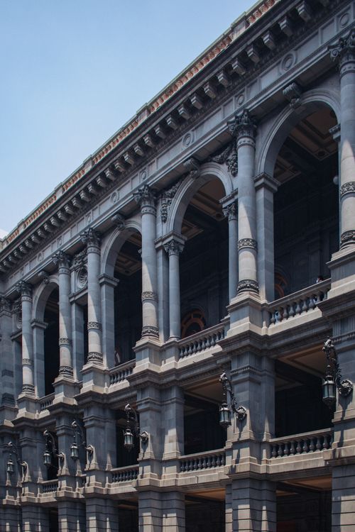 Free Majestic facade of the Museo Nacional de Arte in Mexico City, showcasing neoclassical arches and columns. Stock Photo