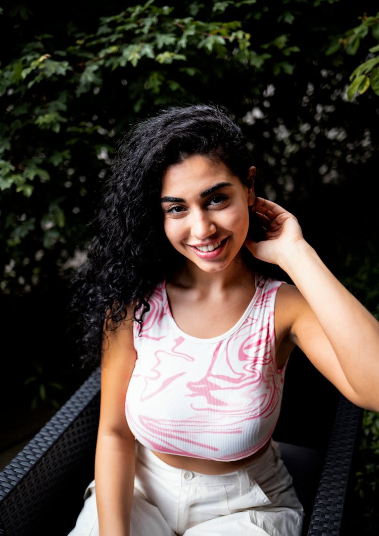 Young Woman In Pink And White Crop Tank Top Smiling