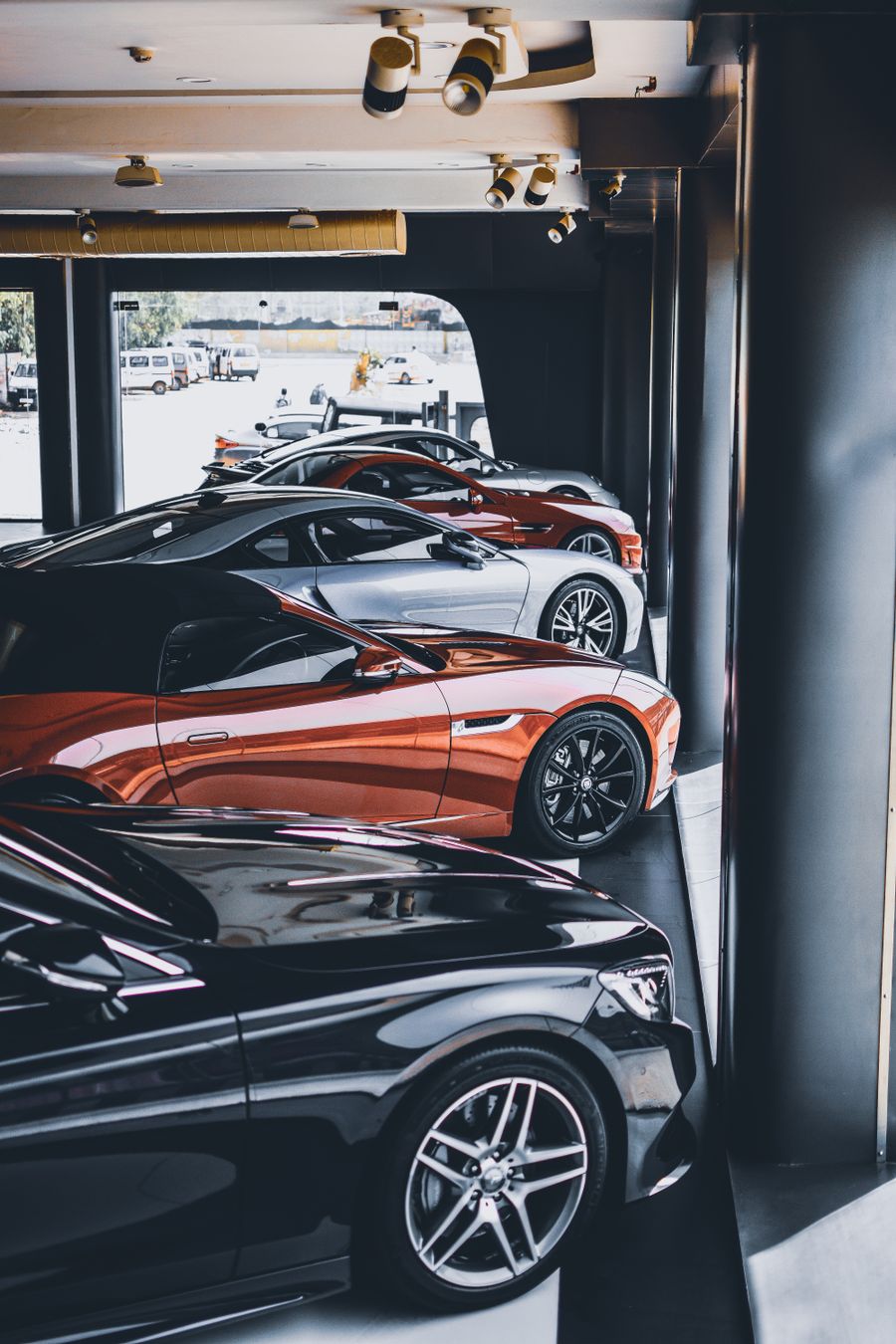 Black luxury executive sedan in a professional showroom