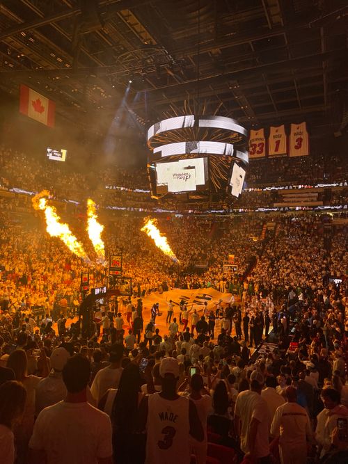 Free High-energy Miami Heat basketball game with a packed stadium and fiery pre-game show. Stock Photo