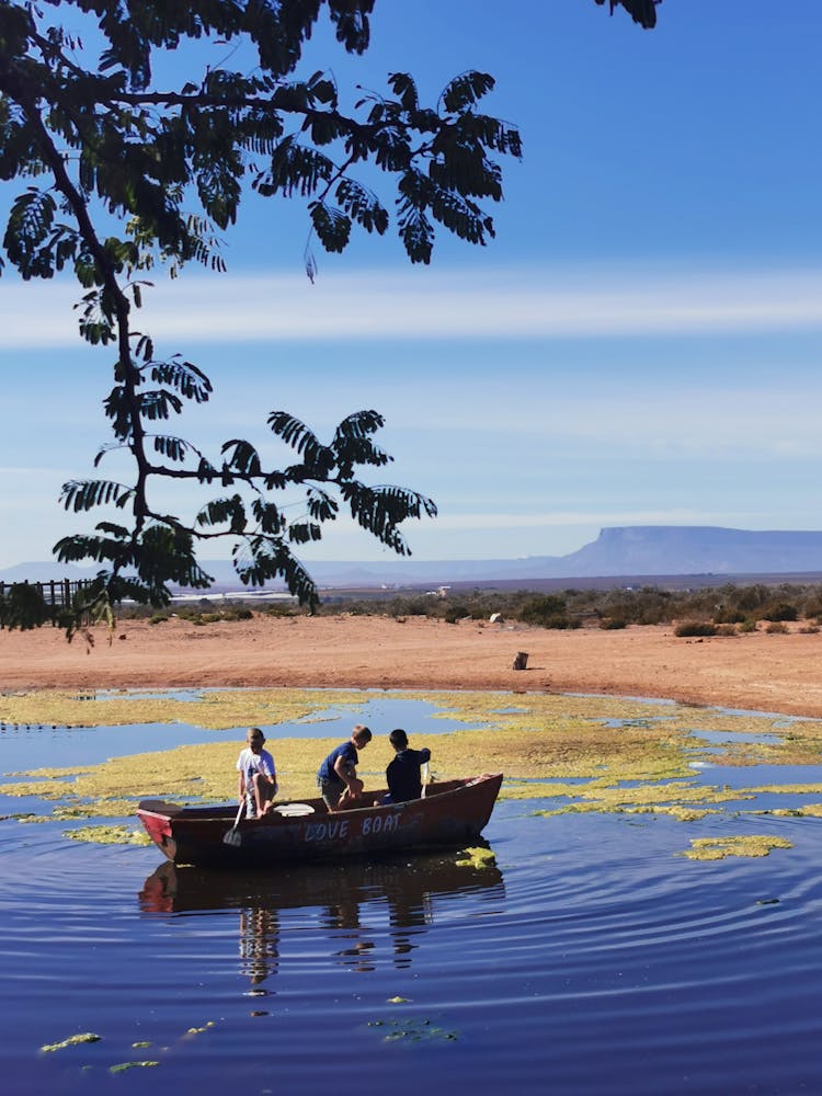 Men In A Boat On A Lake