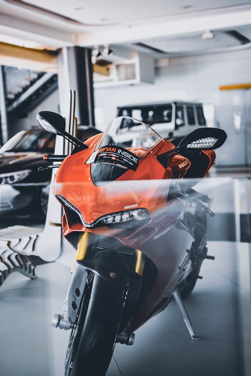 Free Red and Black Sports Bike Parking Inside Garage Stock Photo