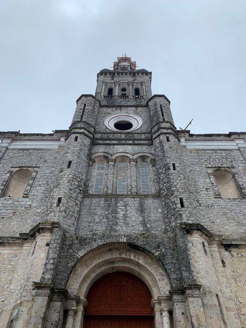 Free Stone facade of Iglesia de San Francisco de Asis, a landmark in Cuetzalan, Mexico. Stock Photo