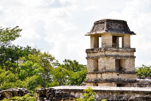 Free Explore the historic ruins of Palenque's iconic tower against a lush green backdrop. Stock Photo