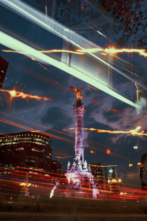 Free Vibrant long exposure of the Angel of Independence at night in Mexico City with dynamic light trails. Stock Photo
