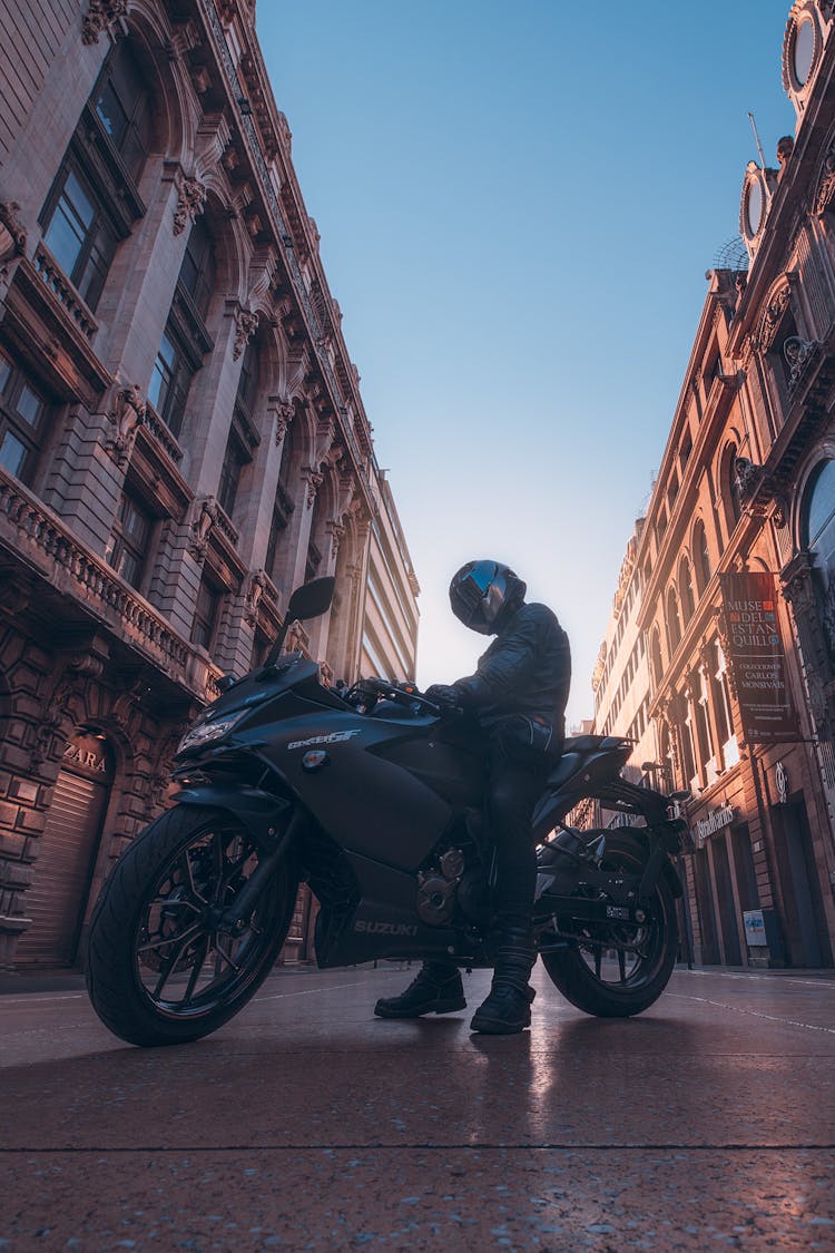 Man On Motorbike On Old City Street