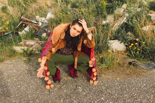 Free Model in fashionable attire posing outdoors amongst urban surroundings. Stock Photo