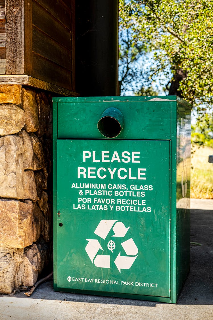 Close-up Photo Of Green Trash Bin 