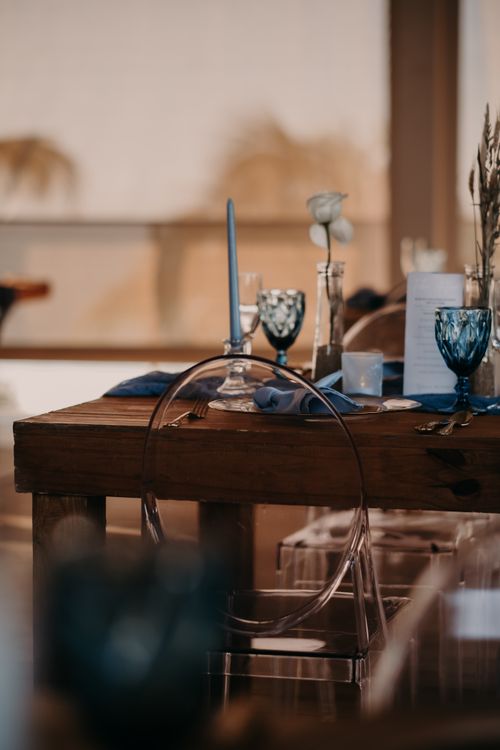 Free Chic table setting with candles, glassware, and wooden table creating a cozy atmosphere. Stock Photo