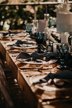 Sophisticated dining setup with blue glassware and elegant decor for a special occasion.