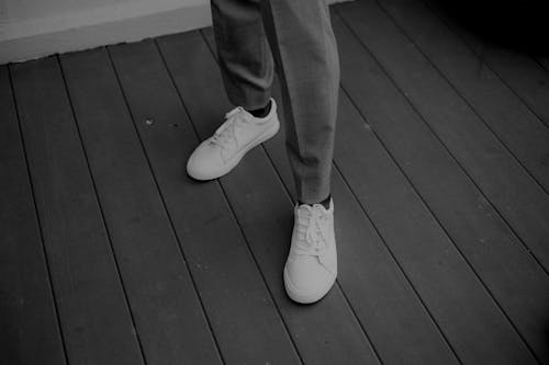 A Person Wearing White Sneakers