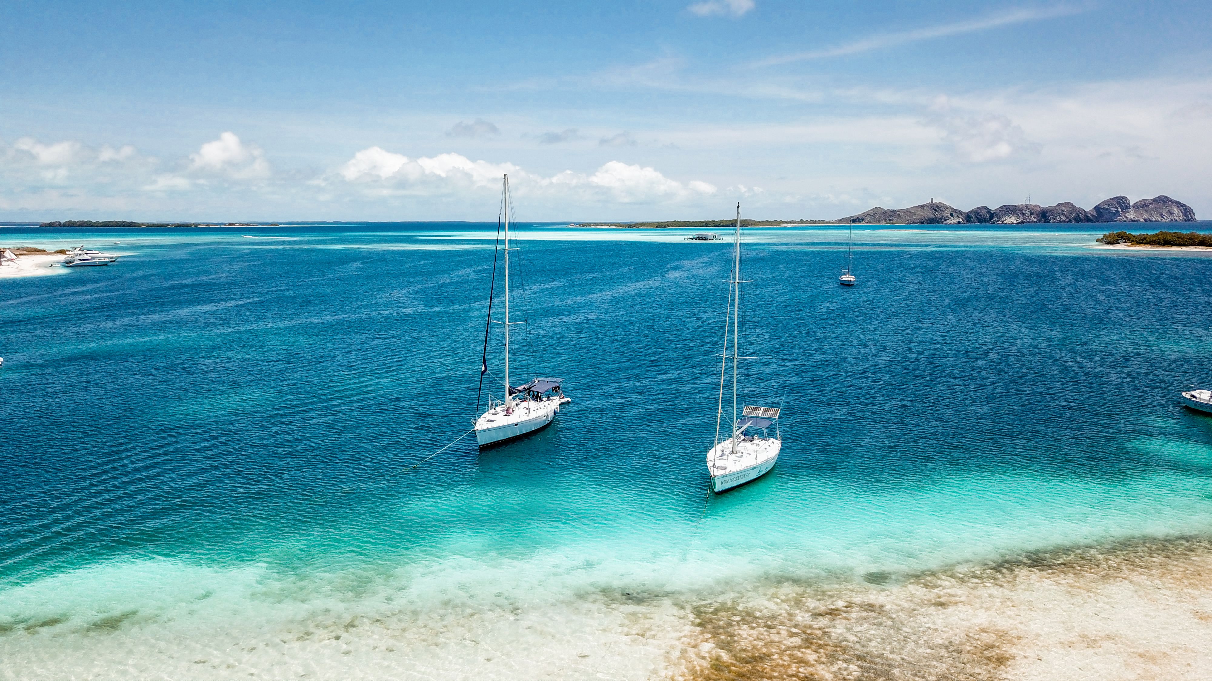 Breathtaking Daysail-6hr-Every Thursday-Road Town to Norman Island Review 2026 - Aerial view of sailboats in turquoise Caribbean waters of Dependencias Federales, Venezuela.