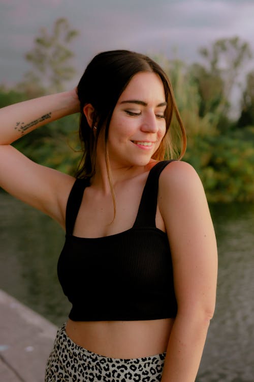 Woman in Black Tank Top Posing