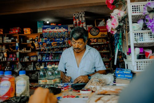 Old Man Selling in Grocery Shop