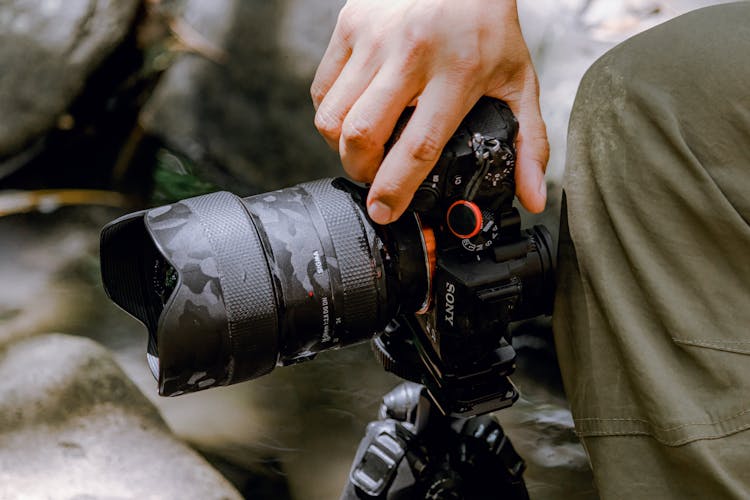 Close Up Of Hand Holding Camera