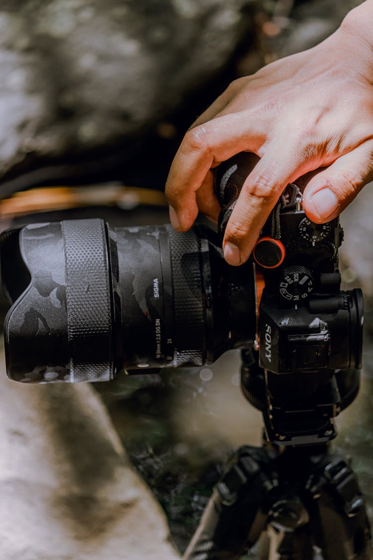 Mans Hand On A Camera