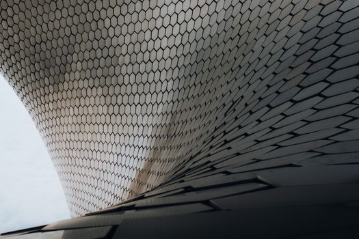 Striking modern architecture of Soumaya Museum in Mexico City, featuring unique hexagonal patterns.