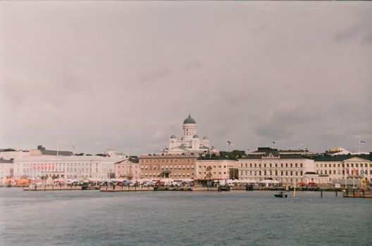 Scenic view of Helsinki Cathedral overlooking a bustling waterfront area.