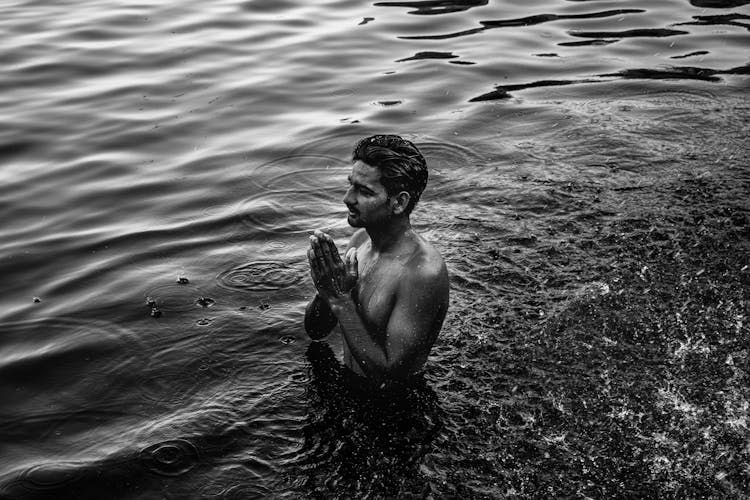 Man Praying In River