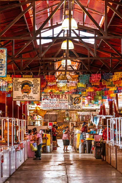 Free Colorful indoor market scene with stalls and shops in Tlacolula, Mexico, bustling with activity. Stock Photo