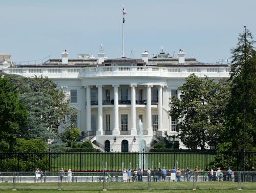 People Standing Outside the Fence of the White House in Washington