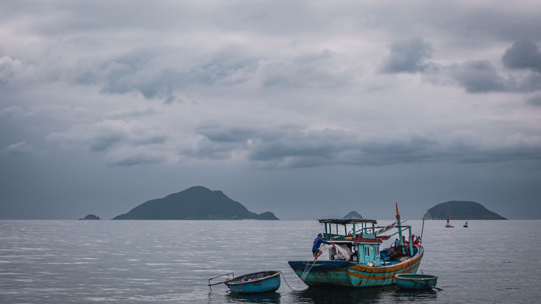 Peaceful seascape with fishing boats and islands in Ba Ria - Vung Tau, Vietnam.