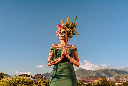 Free Portrait of Woman Wearing Traditional Dia De Los Muertos Makeup Stock Photo