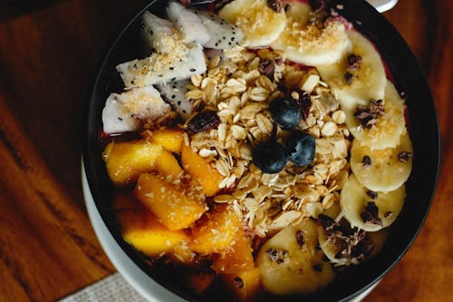 Fruit Slices in Black Ceramic Bowl