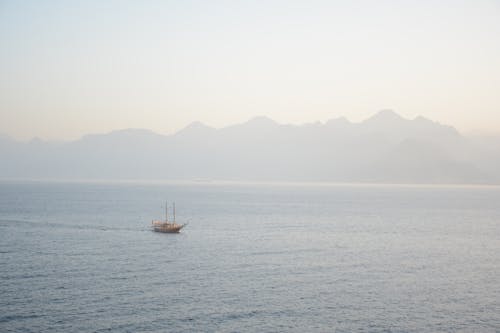 White and Black Boat on Sea