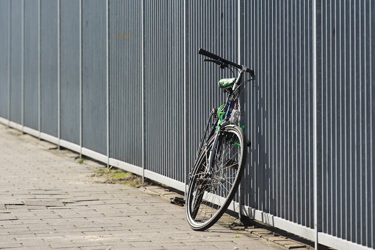 Bike Attached To A Fence 