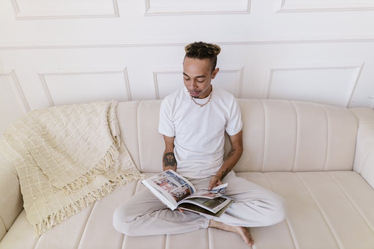 Man Reading On Couch